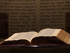 daily Devotion small red leather Bible held in hands