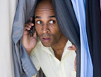 daily Devotion man on cellphone hiding