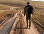 man walking on path