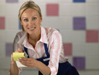 daily Devotion waitress taking a food order wearing a blue apron