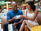 daily Devotion picture of man and woman holding a wrapped present