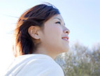 daily Devotion man praising god in sunshine on bright green grass